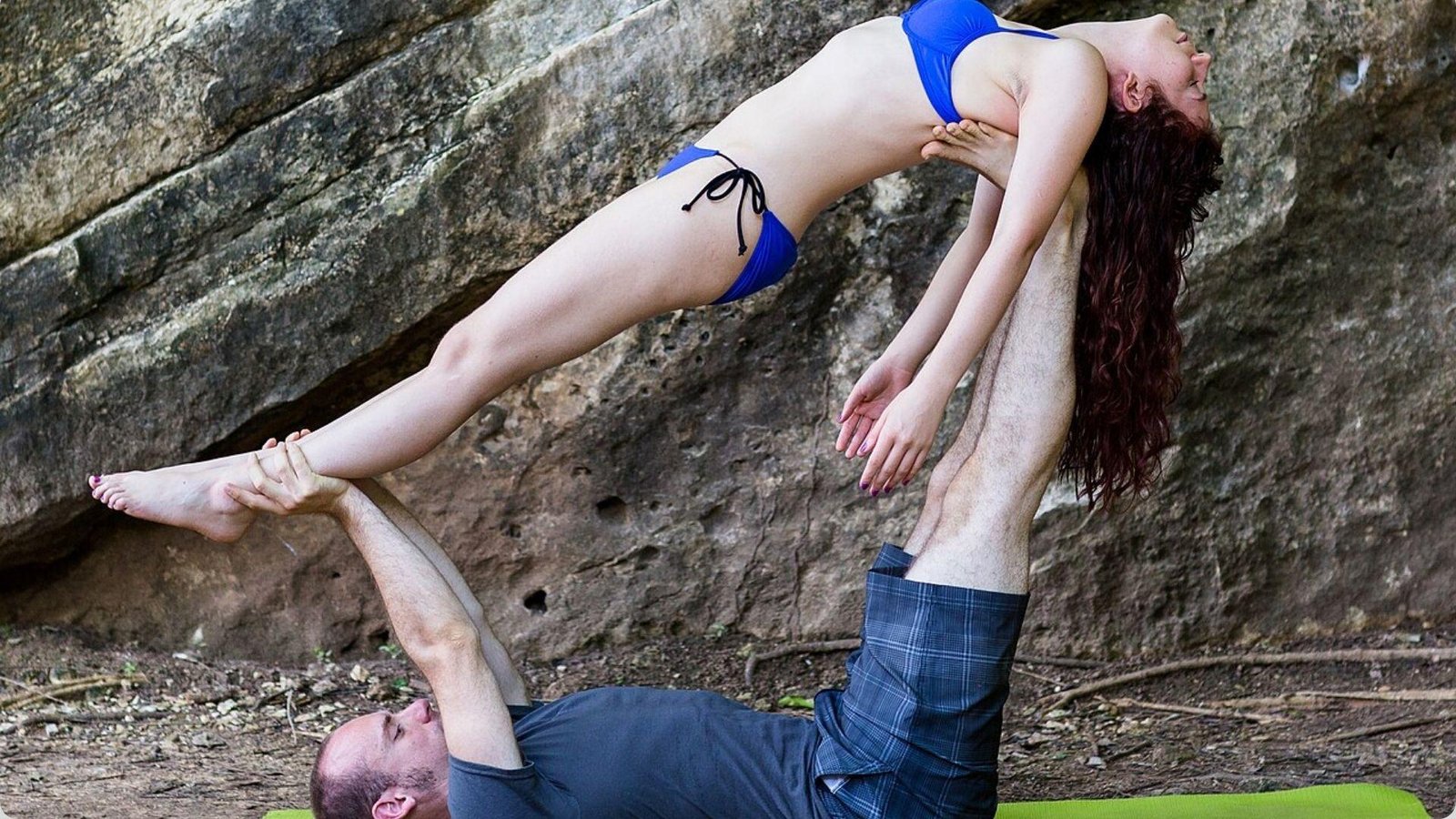 Whale pose is one of the Best Acro Yoga Poses for Beginners