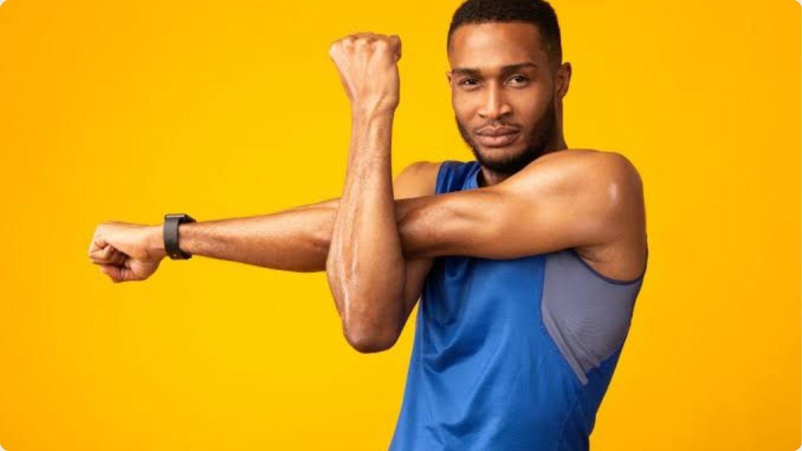 A man flexes his arm, showcasing his bicep against a bright yellow background.