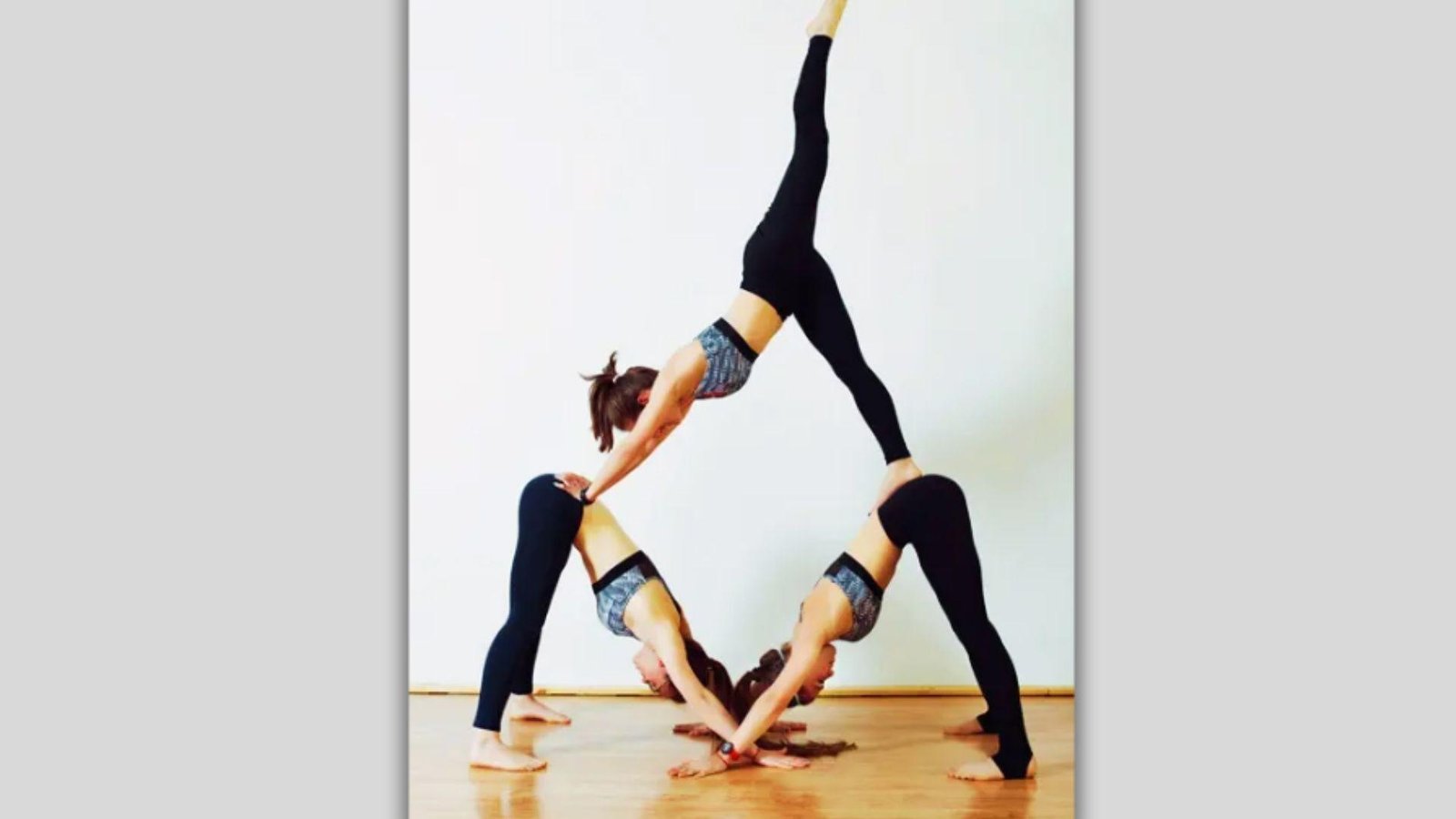 Throne pose is one of the Best Acro Yoga Poses for Beginners